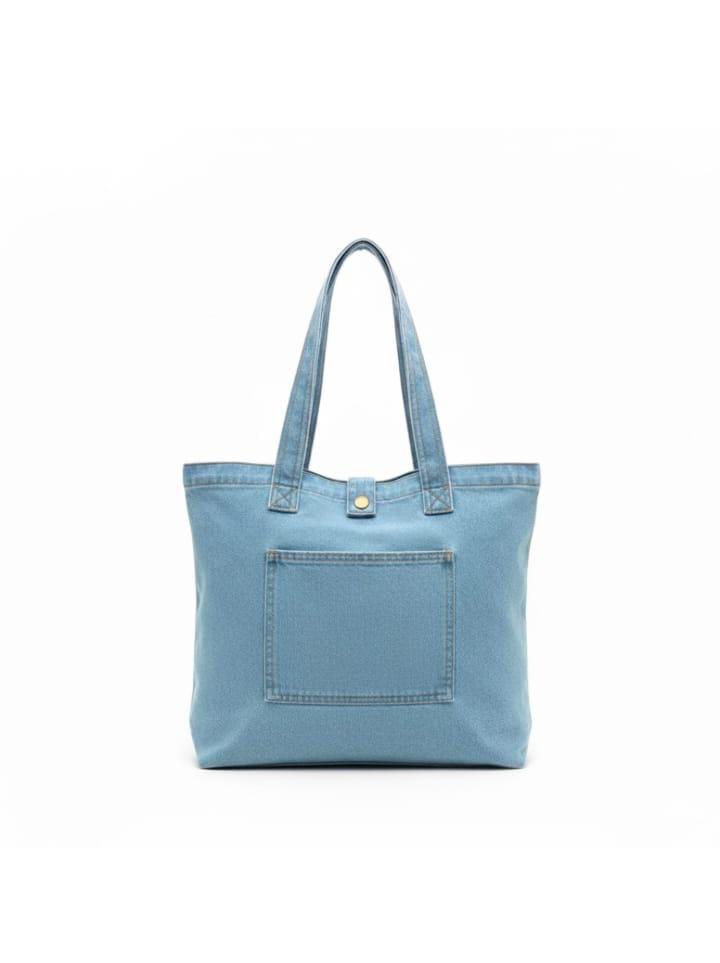 Blue denim tote bag with front pocket and long shoulder handles