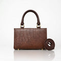 Brown crocodile embossed structured handbag with top handles and shoulder strap