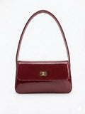 Burgundy patent shoulder handbag with gold-tone clasp